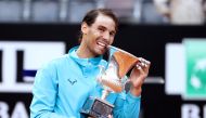 Spain's Rafael Nadal poses as he celebrates winning the final against Serbia's Novak Djokovic with the trophy REUTERS/Matteo Ciambelli