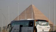 A damaged bus is seen at the site of a blast near a new museum being built close to the Giza pyramids in Cairo, Egyptm May 19, 2019. Reuters/Amr Abdallah Dalsh
 