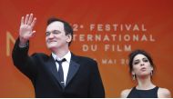 Director Quentin Tarantino and wife Daniella Pick pose. Reuters/Eric Gaillard