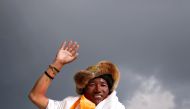 FILE PHOTO: Kami Rita Sherpa, 48, a Nepali mountaineer waves towards the media personnel upon his arrival after climbing Mount Everest for a 22nd time, creating a new record for the most summits of the world's highest mountain, in Kathmandu, Nepal May 20,