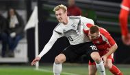:FILE PHOTO: Germany's Julian Brandt in action with Serbia's Miroslav Bogosavac REUTERS/Fabian Bimmer/File Photo