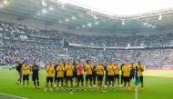 Dortmund players cheer to their supporters after the German First division Bundesliga football match BVB Borussia Moenchengladbach v Borussia Dortmund in Moenchengladbach, western Germany, on May 18, 2019. AFP / LEON KUEGELER 