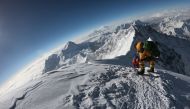 (FILES) In this file photo taken on May 17, 2018, mountaineers make their way to the summit of Mount Everest, as they ascend on the south face from Nepal. AFP / Phunjo Lama 