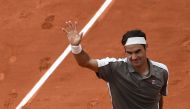 Switzerland's Roger Federer celebrates after winning against Italy's Lorenzo Sonego at the end of their men's singles first round match on day 1 of The Roland Garros 2019 French Open tennis tournament in Paris on May 26, 2019. / AFP / Anne-Christine POUJO