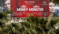 A poster for the film ‘Money Monster’ is displayed outside the Carlton hotel before the start of the 69th Cannes Film Festival in Cannes, May 9, 2016. Reuters/Yves Herman