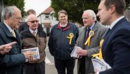 East Midlands Liberal Democrat candidate, Michael Mullaney, (R), councillor David Bill (2R) and Liberal Democrat volunteers prepare to canvass for support ahead of the forthcoming European parliamentary elections, in the town of Hinckley, central England 