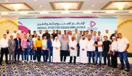 Ezdan Holding Group employees pose for a group photo at the annual Iftar event. 