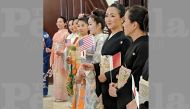  The participants in kimonos holding  flags.