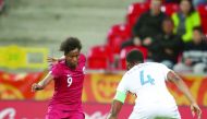 Qatari forward Yusuf Abdurisag (left) vies for the ball possession against United States defender Mark Mckenzie during their final Group D match of the FIFA U-20 World Cup, played in Tychy, Poland, yesterday.