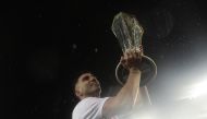 FILE PHOTO:  Sevilla's Spanish midfielder Jose Antonio Reyes raises the trophy after winning the UEFA Europa League final football match between Liverpool FC and Sevilla FC at the St Jakob-Park stadium in Basel.  .  AFP / Javier SORIANO