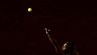 Serena Williams of the US eyes the ball as she serves the ball to Sofia Kenin of the US during their women's singles third round match on day seven of The Roland Garros 2019 French Open tennis tournament in Paris on June 1, 2019. / AFP / Philippe LOPEZ