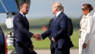 US President Donald Trump (C) being greeted by Irish Prime Minsiter Leo Varadkar (L) upon disembarking Air Force One upon arrival at Shannon Airport, Ireland on June 5, 2019. AFP/ Irish Government