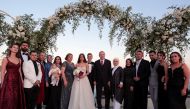 Turkish President Tayyip Erdogan and his wife Emine Erdogan pose with Arsenal's German soccer player Mesut Ozil, who is of Turkish descent, and his fiancee Amina Gulse during their wedding ceremony in Istanbul, Turkey, June 7, 2019. Murat Cetinmuhurdar/Pr