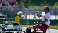 Lewis Hamilton of Great Britain and Mercedes GP waves to the crowd on the driver's parade before the F1 Grand Prix of Canada at Circuit Gilles Villeneuve on June 09, 2019 in Montreal, Canada. Dan Mullan/AFP