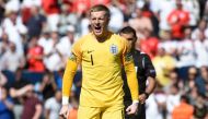 England's goalkeeper Jordan Pickford celebrates a goal during the penalty shootout during the UEFA Nations League third place football match between England and Switzerland at the D.Afonso Henriques stadium in Guimaraes, on June 9, 2019 / AFP / MIGUEL RIO