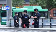Police members are seen at Malmo central station after shooting a man for 