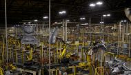 FILE PHOTO: Robotic arms bring together car frames for welding at Nissan Motor Co's automobile manufacturing plant in Smyrna, Tennessee, U.S., August 23, 2018. REUTERS/William DeShazer