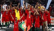 Portugal's Cristiano Ronaldo and team mates celebrate winning the UEFA Nations League Final with the trophy Action Images via Reuters/Carl Recine