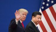 FILE PHOTO: US President Donald Trump (L) and China's President Xi Jinping leaving a business leaders event at the Great Hall of the People in Beijing. AFP / Nicolas ASFOURI