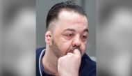 FILE PHOTO:  Former nurse Niels Hoegel, accused of killing more than 100 patients in his care, waits at court for his verdict at court in Oldenburg, northern Germany.   ALTERNATIVE CROP / AFP