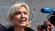 FILE PHOTO: French far-right Rassemblement National (RN) President and member of Parliament Marine Le Pen leaves the polling station after casting her vote for the European Parliament elections in Henin-Beaumont.  AFP / DENIS CHARLET