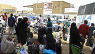 Passengers wait for their shuttle at the main bus station in Khartoum, linking the Sudanese capital with various parts of the country, on June 12, 2019.  AFP
 