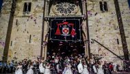 Brides and grooms pose for a photo outside the Lisbon's cathedral following their wedding ceremony in Lisbon on June 12, 2019.
