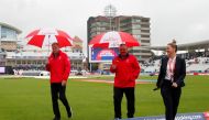 Umpires Marais Erasmus and Paul Reiffel after the match was abandoned Action Images via Reuters/Andrew Boyers