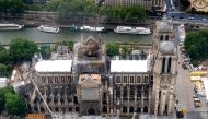 This aerial picture taken on June 12, 2019, in the French capital Paris shows the Notre Dame de Paris cathedral under repair after it was badly damaged by a huge fire on April 15. / AFP / Lionel BONAVENTURE