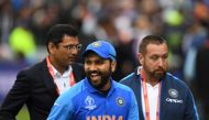 India's Rohit Sharma (C) smiles after receiving the man of the match award following victory the 2019 Cricket World Cup group stage match between India and Pakistan at Old Trafford in Manchester, northwest England, on June 16, 2019.  AFP / Dibyangshu Sark