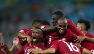 Qatar's Boualem Khoukhi celebrates scoring their second goal with team mates. Reuters/Pilar Olivares
