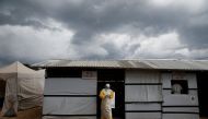 FILE PHOTO: A health worker wearing Ebola protection gear, leaves the dressing room before entering the Biosecure Emergency Care Unit (CUBE) at the ALIMA (The Alliance for International Medical Action) Ebola treatment centre in Beni, in the Democratic Rep