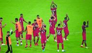 Qatari players applaud fans after drawing their opening Group B match of 2019 Copa America against Paraguay at the Maracana Stadium in Rio de Janeiro, Brazil, on Sunday.
