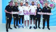 Manchester City player Riyad Mahrez (third right) and Algeria coach Djamel Belmadi (right) pose for a picture with other Algerian national team players and officials during their visit to the  Supreme Committee for Delivery & Legacy  Pavilion. 