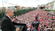 Turkish President Recep Tayyip Erdogan addresses the crowd during the mass opening ceremony in front of Sancaktepe Municipality in Istanbul, Turkey on June 19, 2019.  Anadolu 