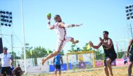 A Qatari player prepares to score against Iran during the semi-final of the AHF Asian Beach Handball Championships in Weihai, China, yesterday. 