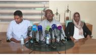 This AFPTV screen grab from a video made on June 23, 2019 shows Babiker Faisal (C), one of Sudan's protest leaders reading out a statement saying that they have accepted the creation of a civilian-majority governing body for a political transition in Suda