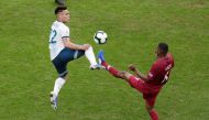 Argentina's Lautaro Martinez in action with Qatar's Abdelaziz Mohamed. Reuters/Ueslei Marcelino