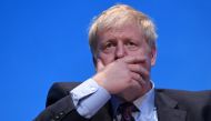 File photo of Conservative MP Boris Johnson gestures as he answers questions from journalist Iain Dale as he takes part in a Conservative Party leadership hustings event in Birmingham, central England on June 22, 2019. / AFP / Oli SCARFF 