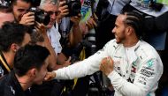 Winner Mercedes' British driver Lewis Hamilton (R) is congratulated by team-mates after the Formula One Grand Prix de France at the Circuit Paul Ricard in Le Castellet, southern France, on June 23, 2019. / AFP / GERARD JULIEN