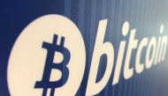 FILE PHOTO: A Bitcoin logo is seen on a cryptocurrency ATM in Santa Monica, California, U.S., January 4, 2018. REUTERS/Lucy Nicholson