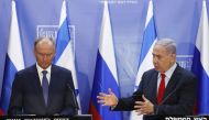 Secretary of Russia's Security Council Nikolai Patrushev, listens as Israeli Prime Minister Benjamin Netanyahu speaks in Jerusalem on June 24, 2019. AFP/Pool/Ronen Zvulun 