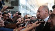 President of Turkey and leader of Turkey's ruling Justice and Development (AK) Party Recep Tayyip Erdogan (2nd R) speaks to media after his party's parliamentary group meeting at the Grand National Assembly of Turkey in Ankara, Turkey on June 25, 2019. 