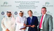 Qatar Racing & Equestrian Club (QREC) Chairman Issa bin Mohammed Al Mohannadi and the Duke of Richmond, owner of Goodwood Racecourse exchange documents during the sponsorship signing ceremony. QREC CEO Nasser bin Sherida Al Kaabi is also present.
