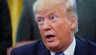 FILE PHOTO: US President Donald Trump speaks before signing an executive order in the Oval Office of the White House in Washington, DC.  AFP / MANDEL NGAN