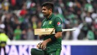 Pakistan's Babar Azam walks off the field as he celebrates after victory in the 2019 Cricket World Cup group stage match between New Zealand and Pakistan at Edgbaston in Birmingham, central England, on June 26, 2019.  AFP / Paul Ellis