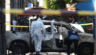 Police officers are seen at the site of an explosion in downtown Tunis, Tunisia, June 27, 2019. REUTERS/Zoubeir Souissi