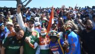 Pakistan (L) and Indian super fans cheer during the 2019 Cricket World Cup group stage match between West Indies and India at Old Trafford in Manchester, northwest England, on June 27, 2019. / AFP / Dibyangshu Sarkar