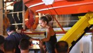 Carola Rackete, the 31-year-old Sea-Watch 3 captain, is escorted off the ship by police and taken away for questioning, in Lampedusa, Italy June 29, 2019. (REUTERS/Guglielmo Mangiapane)