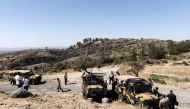 Members of the northen Cypriot security forces gather at the scene where according to officials a suspected Russian missile exploded overnight on July 1, 2019, in the divided island, during an Israeli aerial raid in Syria. AFP / Lakovos Hatzistavrou